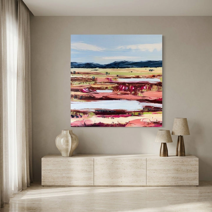 Stretched canvas wall art styled on the wall in a luxe living room