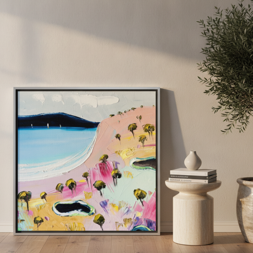 Canvas wall art with a silver leaf surround leaning against the wall in a luxe home office