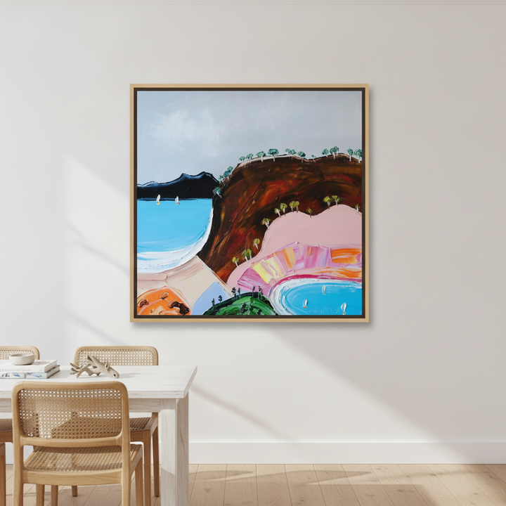 Oversized statement canvas wall art with a natural timber surround styled on the wall in a coastal dining room