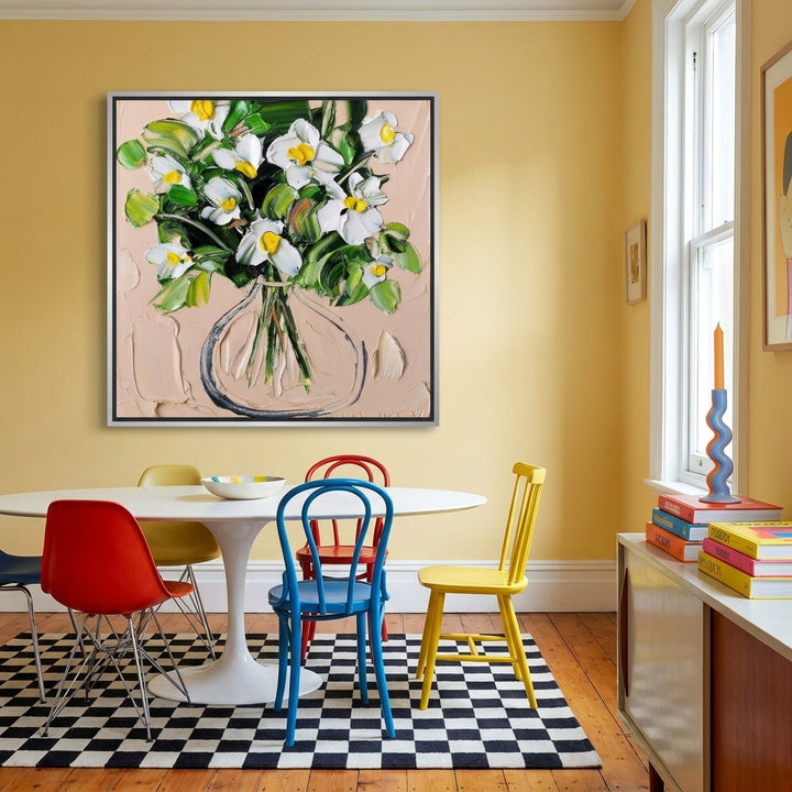 Oversized statement canvas wall art with a silver leaf surround styled on the wall in a colourful eclectic dining room