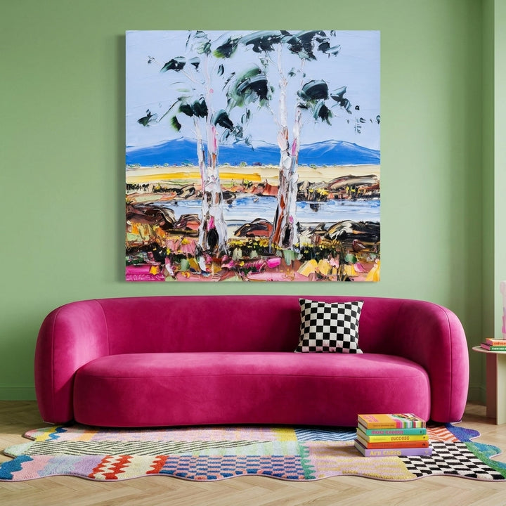 Stretched canvas wall art styled on the wall in a colourful eclectic living room