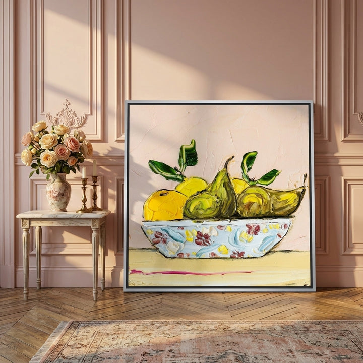 Canvas wall art with a silver leaf surround leaning against the wall in a Parisian living room