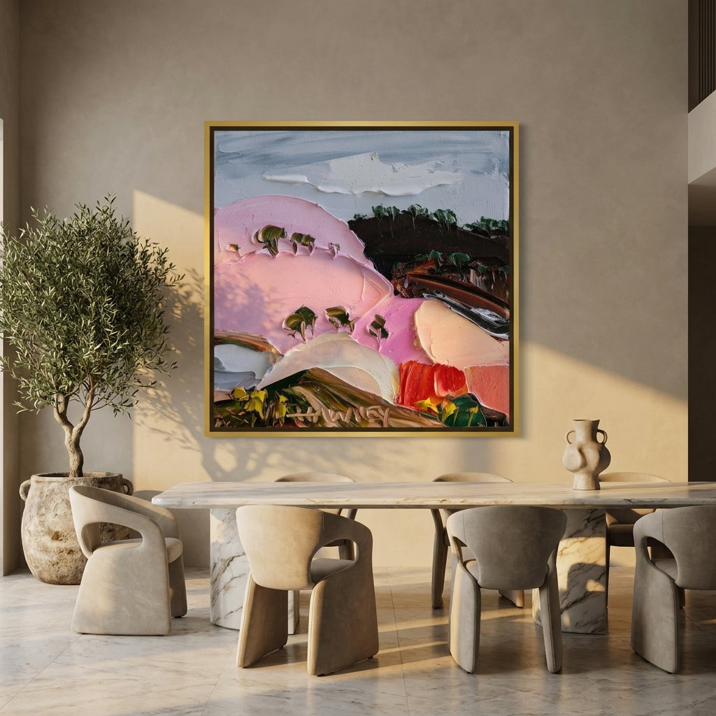 Oversized statement canvas wall art with a gold leaf surround styled on the wall in a luxe dining room