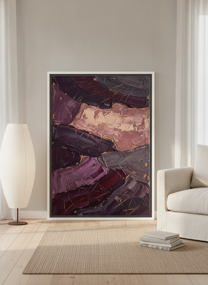 Canvas wall art with a white surround leaning against the wall in a warm Japandi bedroom