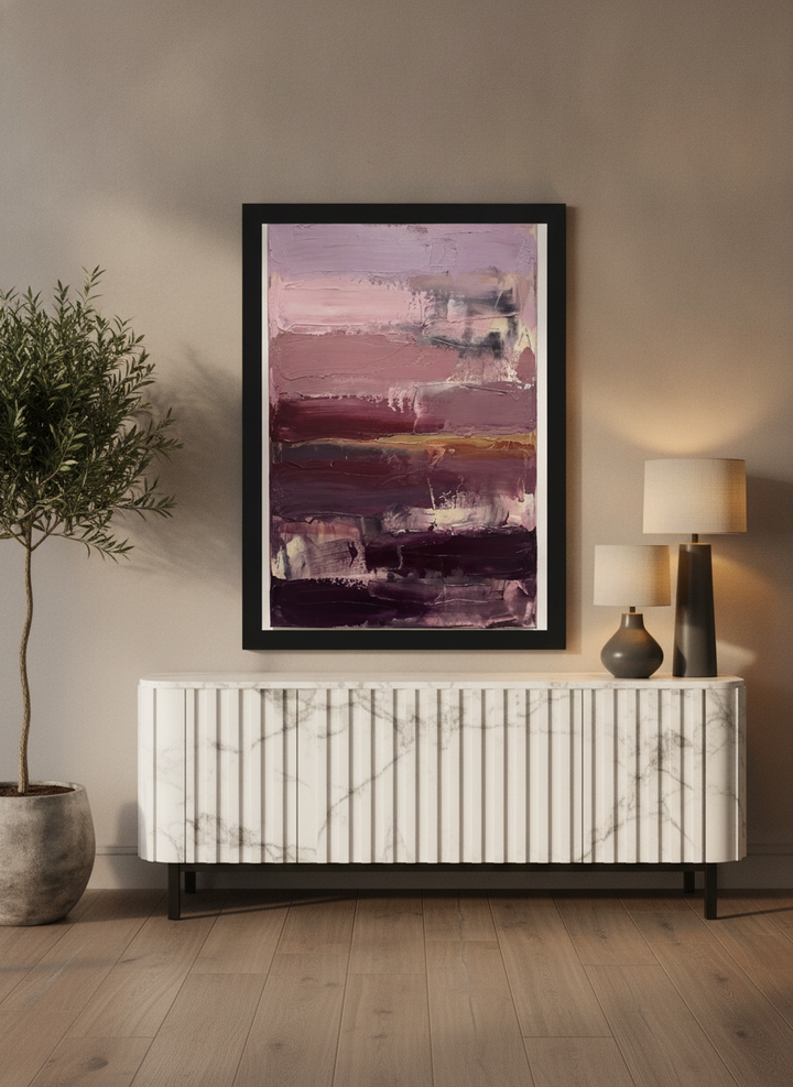 Modern wall art print standing on a sideboard in a luxe bedroom