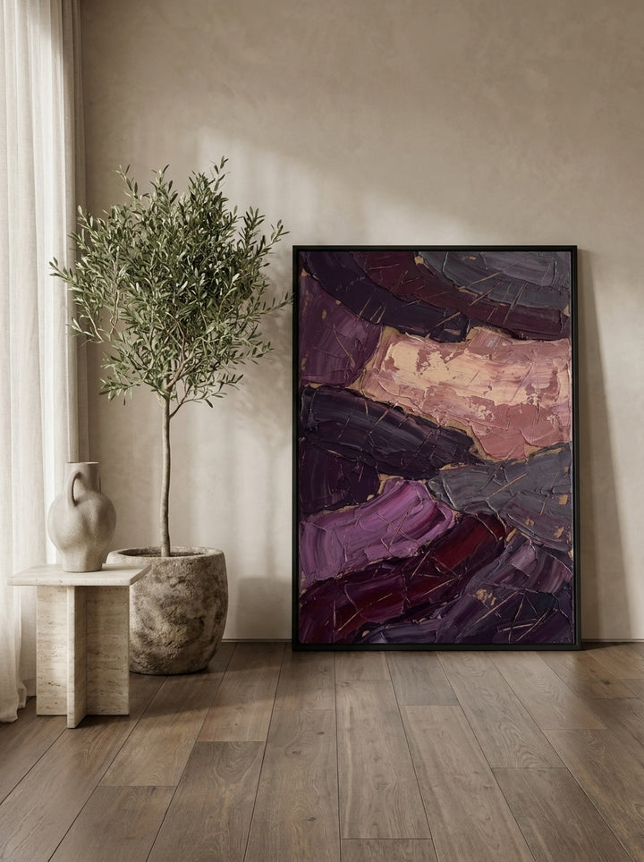 Oversized statement modern wall art print leaning against the wall in a luxe bedroom