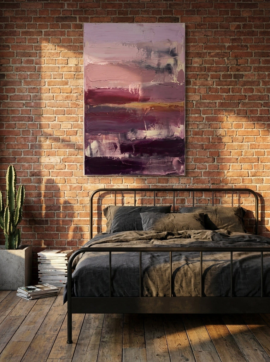 Stretched canvas wall art styled on the wall in an industrial loft bedroom