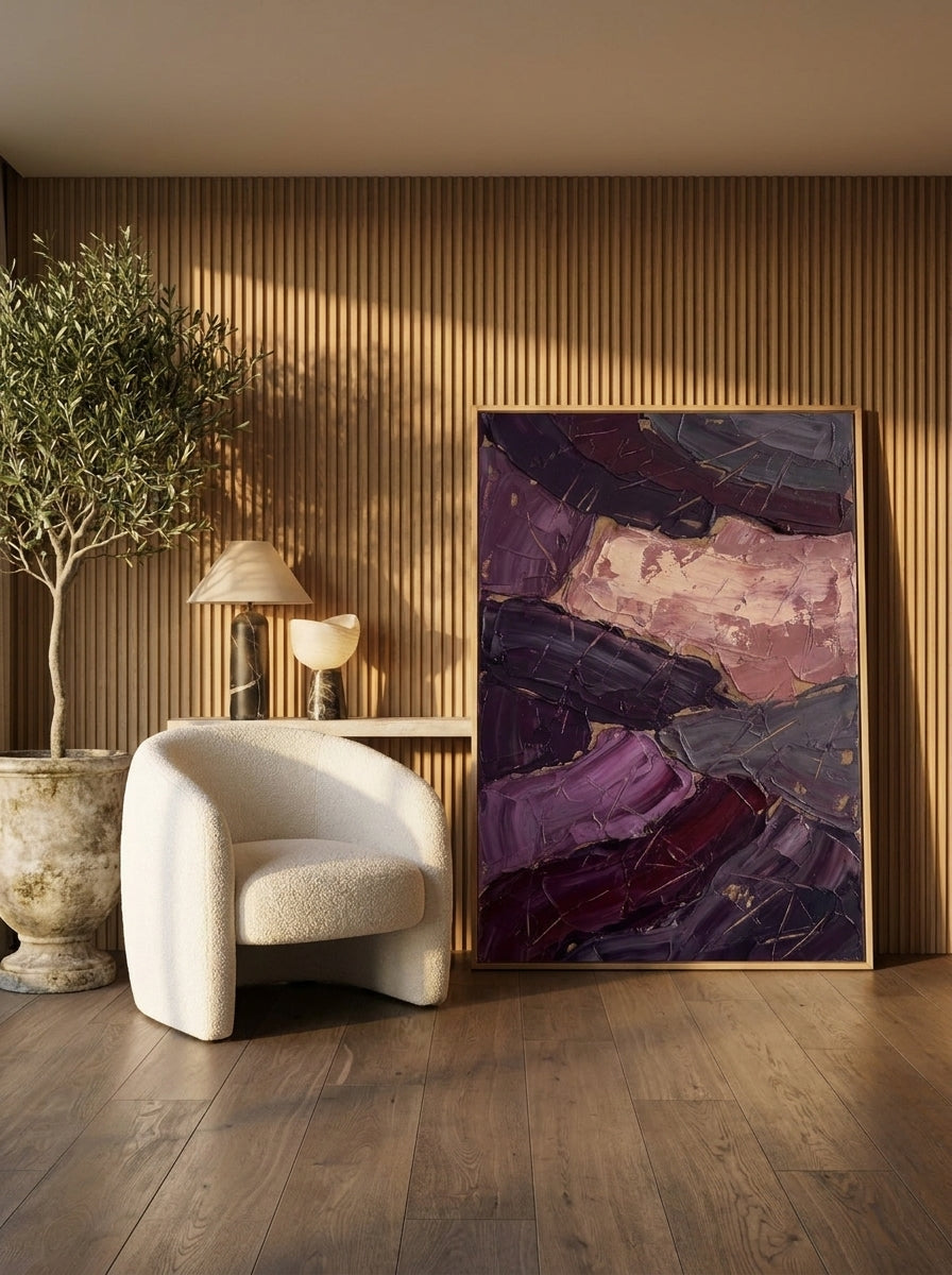 Oversized statement modern wall art print leaning against the wall in a luxe bedroom