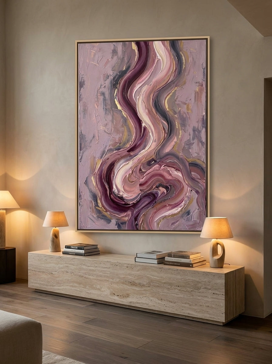 Oversized statement canvas wall art with a natural timber surround styled on the wall in a luxe living room
