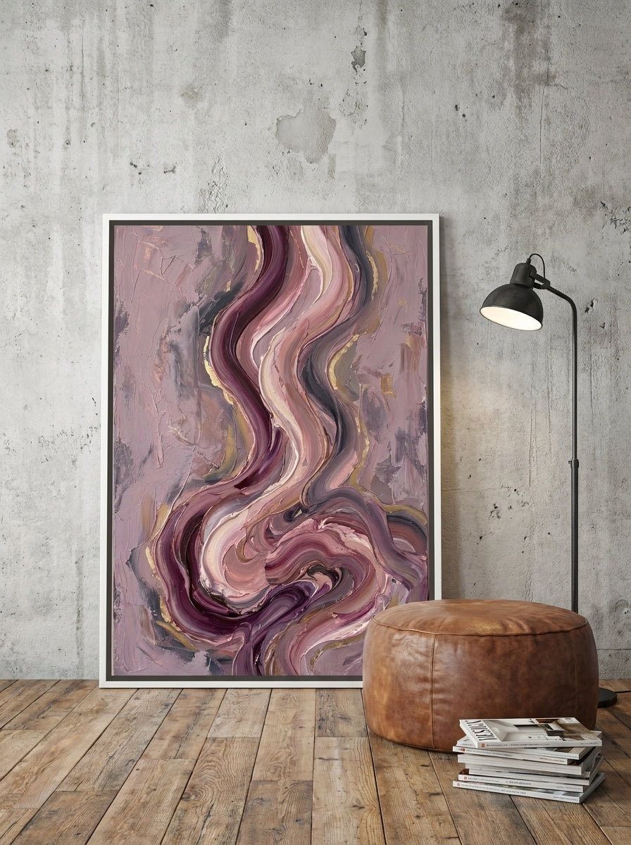 Oversized statement canvas wall art with a white surround leaning against the wall in an industrial loft dining room