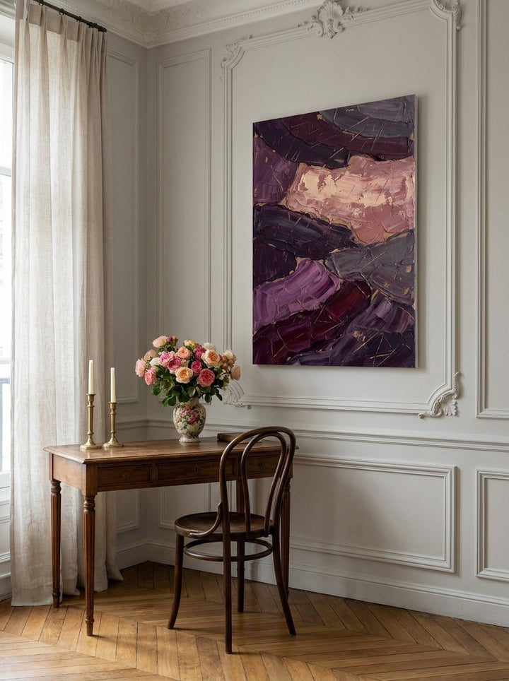 Stretched canvas wall art styled on the wall in a Parisian home office