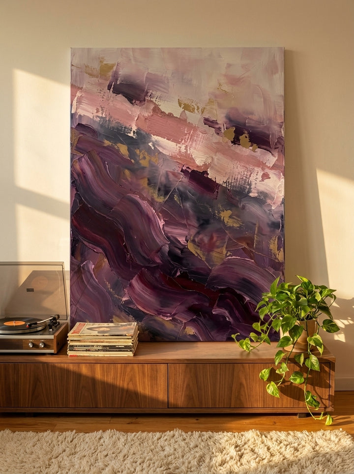 Stretched canvas wall art standing on a sideboard in a retro 70s bedroom