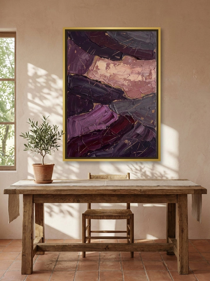 Canvas wall art with a gold leaf surround styled on the wall in a Mediterranean home office