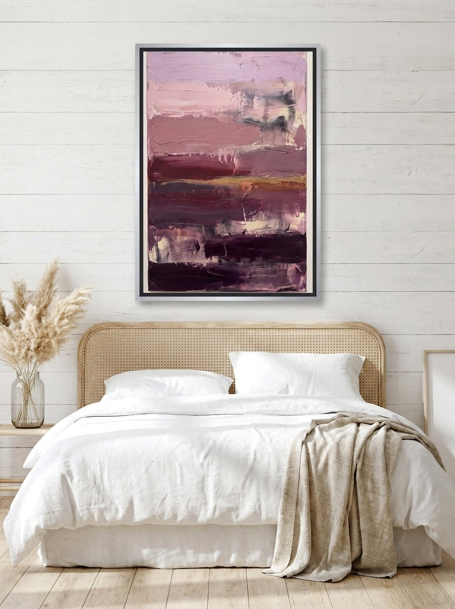 Canvas wall art with a silver leaf surround styled on the wall in a coastal bedroom