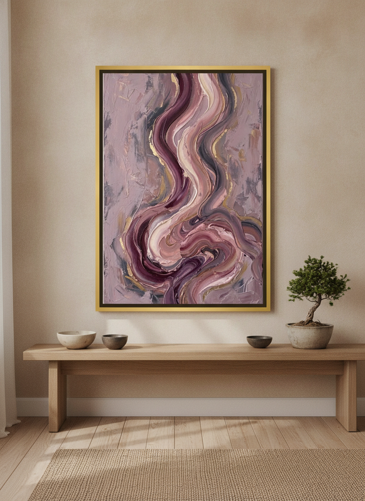 Canvas wall art with a gold leaf surround standing on a bench in a warm Japandi living room