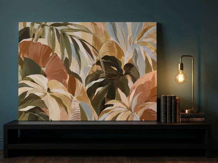 Stretched canvas wall art standing on a console in a moody bedroom