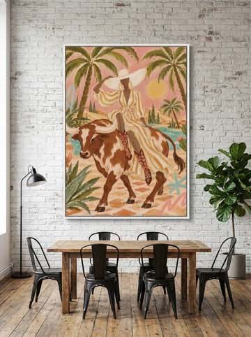 Oversized statement canvas wall art with a white surround styled on the wall in an industrial loft dining room