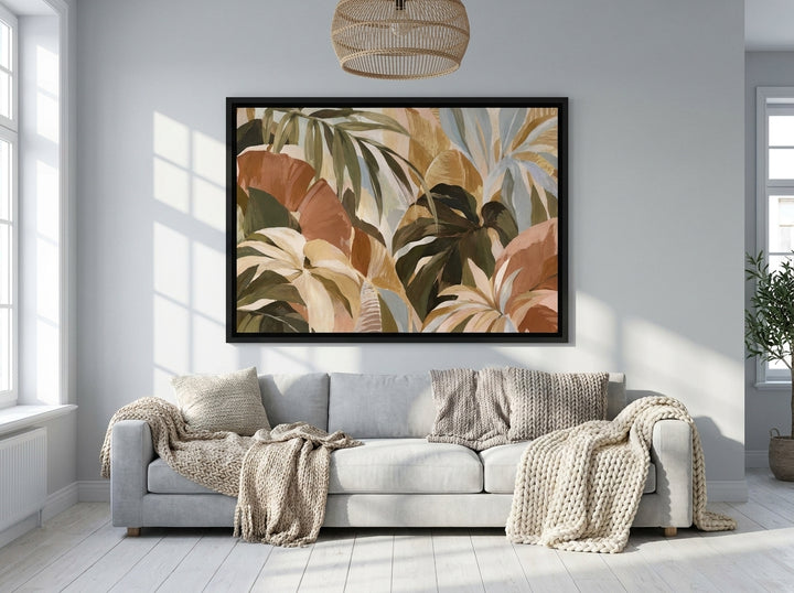 Oversized statement canvas wall art with a black surround styled on the wall in a bright Scandinavian living room