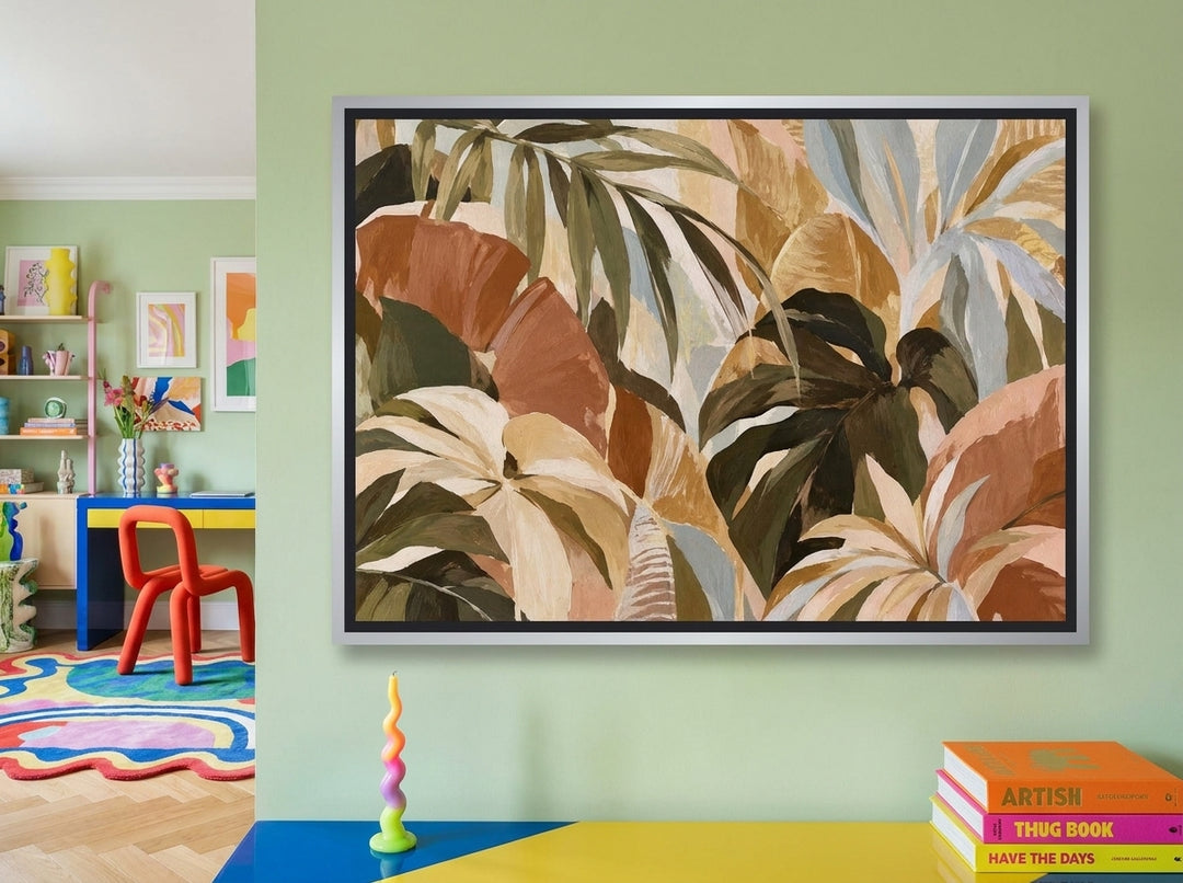 Canvas wall art with a silver leaf surround styled on the wall in a colourful eclectic home office