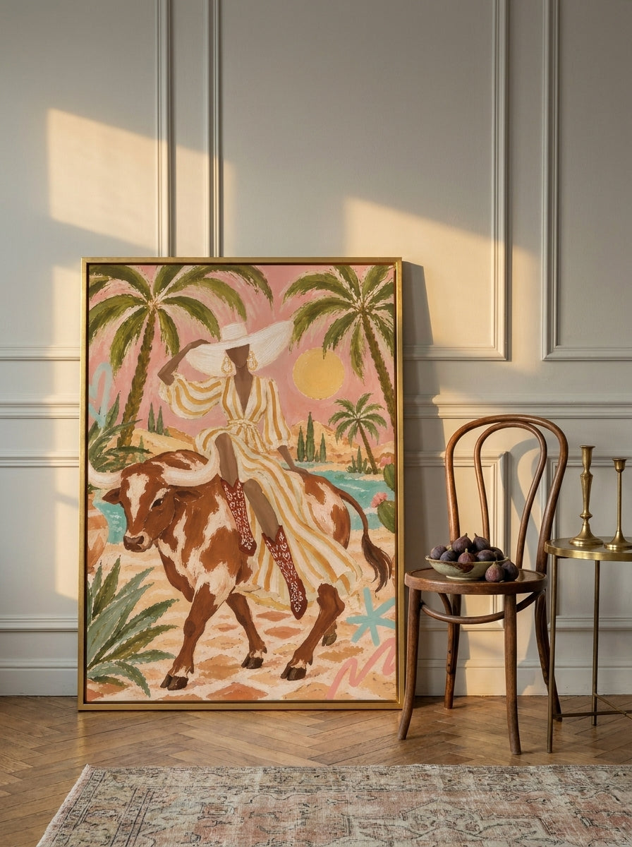 Canvas wall art with a gold leaf surround leaning against the wall in a Parisian living room