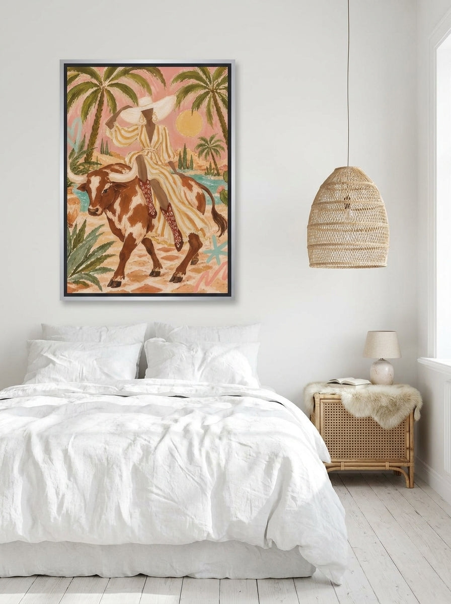 Canvas wall art with a silver leaf surround styled on the wall in a bright Scandinavian bedroom