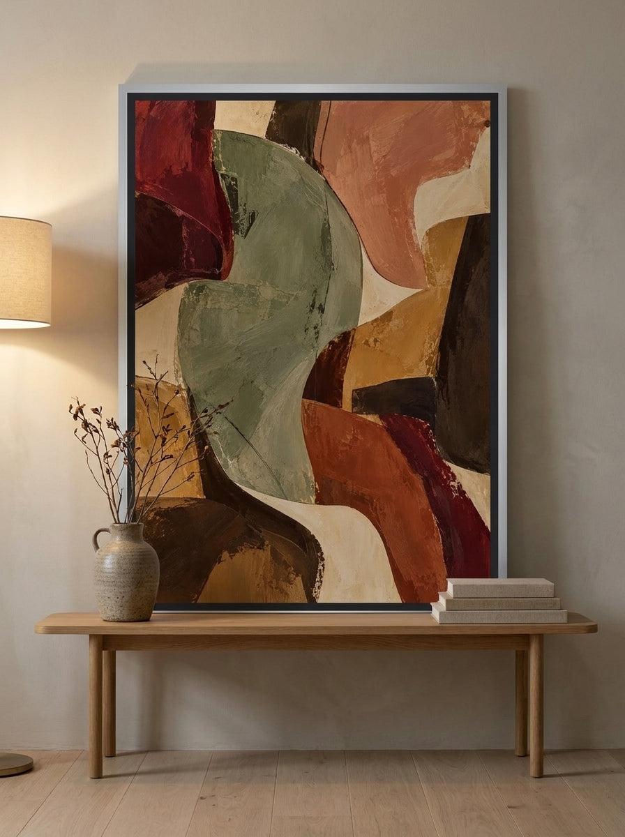 Canvas wall art with a silver leaf surround standing on a bench in a warm Japandi home office
