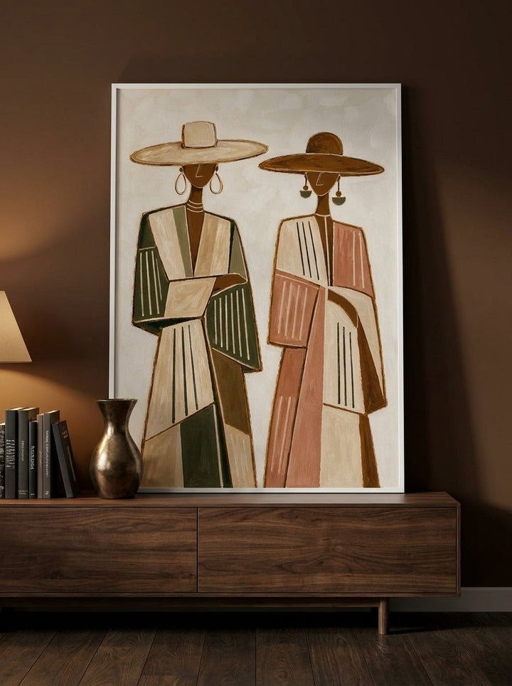 Modern wall art print standing on a sideboard in a moody bedroom