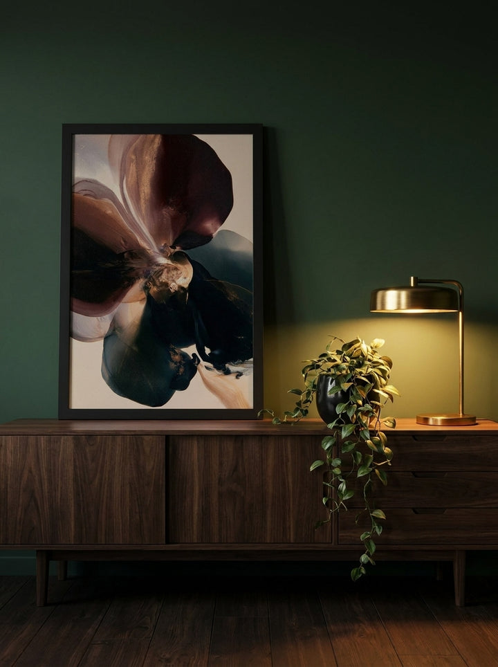 Modern wall art print standing on a sideboard in a moody bedroom