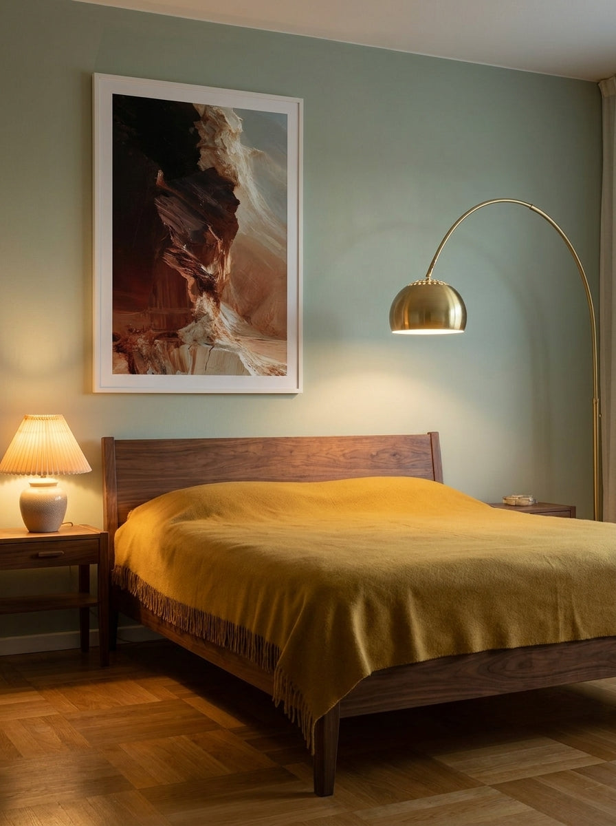 Modern wall art print styled on the wall in a mid-century bedroom