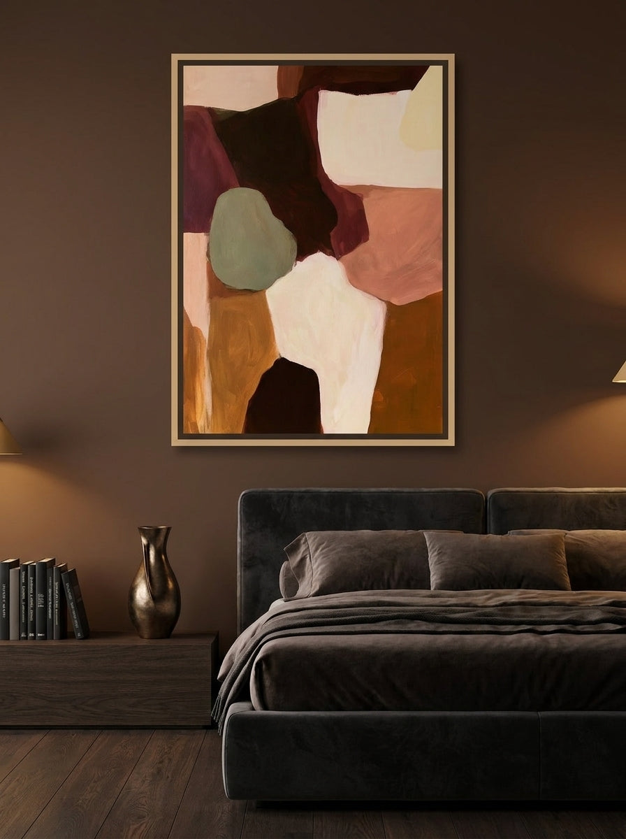 Canvas wall art with a natural timber surround styled on the wall in a moody bedroom