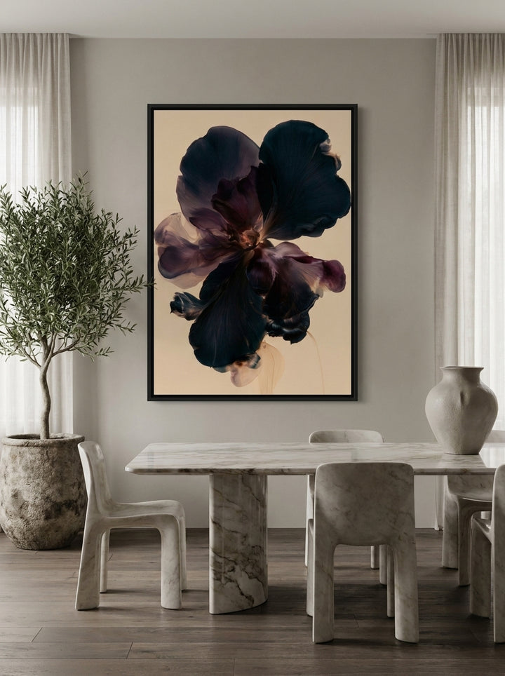 Canvas wall art with a black surround styled on the wall in a luxe dining room