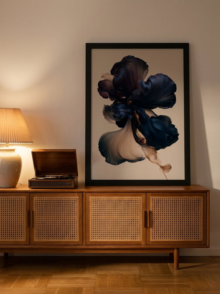 Modern wall art print standing on a sideboard in a mid-century home office