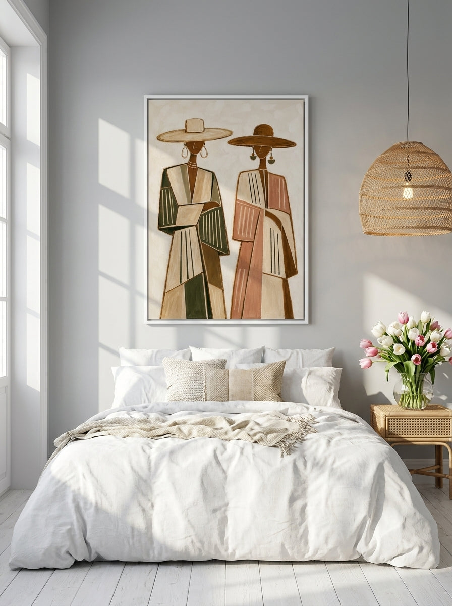 Canvas wall art with a white surround styled on the wall in a bright Scandinavian bedroom