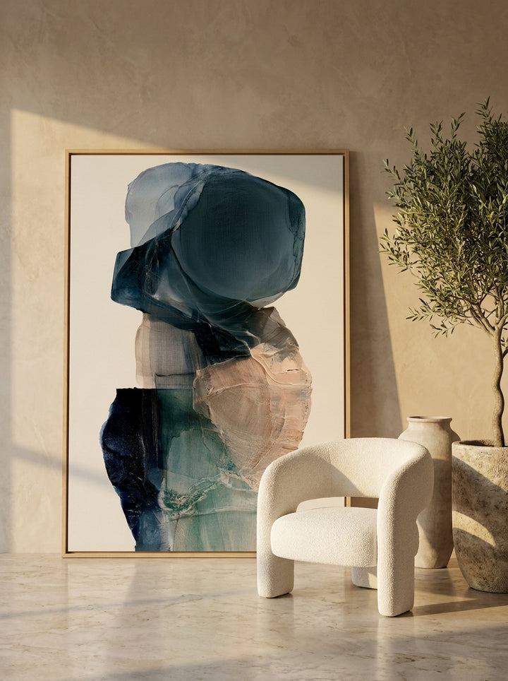 Oversized statement canvas wall art with a natural timber surround leaning against the wall in a luxe dining room