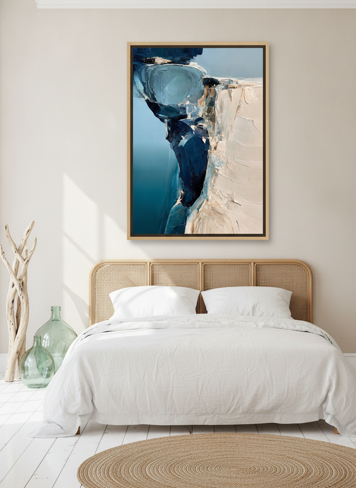 Oversized statement canvas wall art with a natural timber surround styled on the wall in a coastal bedroom