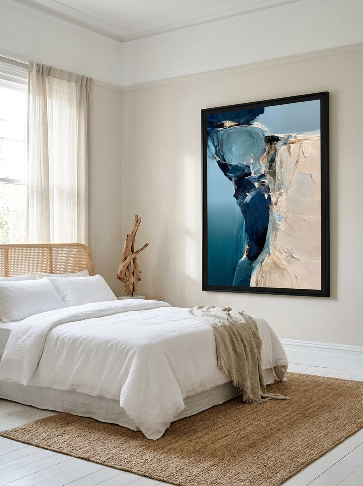 Oversized statement modern wall art print styled on the wall in a coastal bedroom