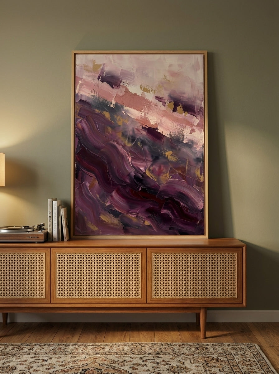 Modern wall art print standing on a sideboard in a mid-century dining room
