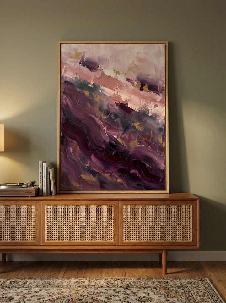 Modern wall art print standing on a sideboard in a mid-century dining room