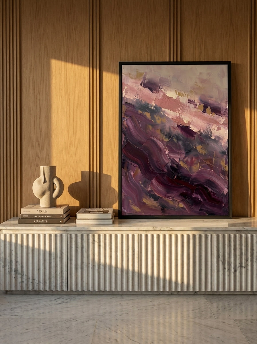 Modern wall art print standing on a sideboard in a luxe bedroom