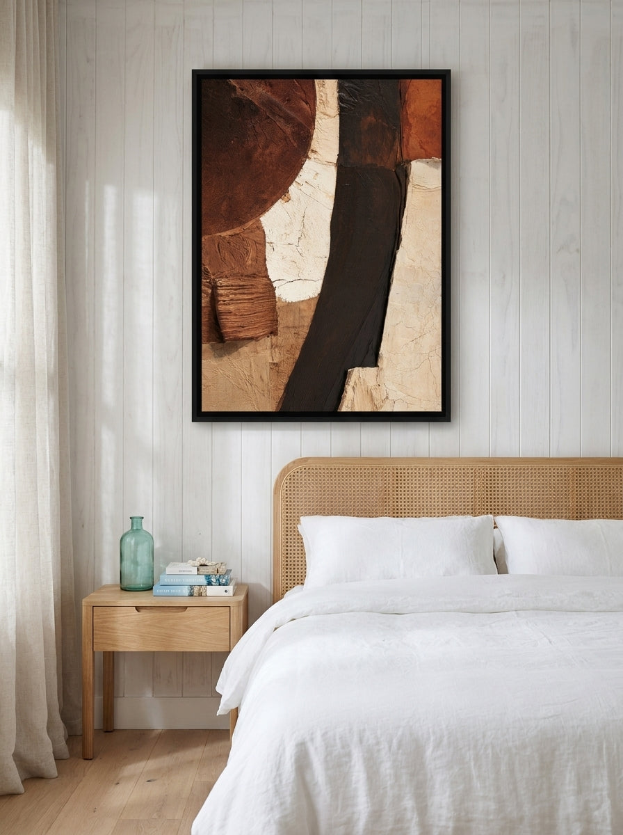 Canvas wall art with a black surround styled on the wall in a coastal bedroom