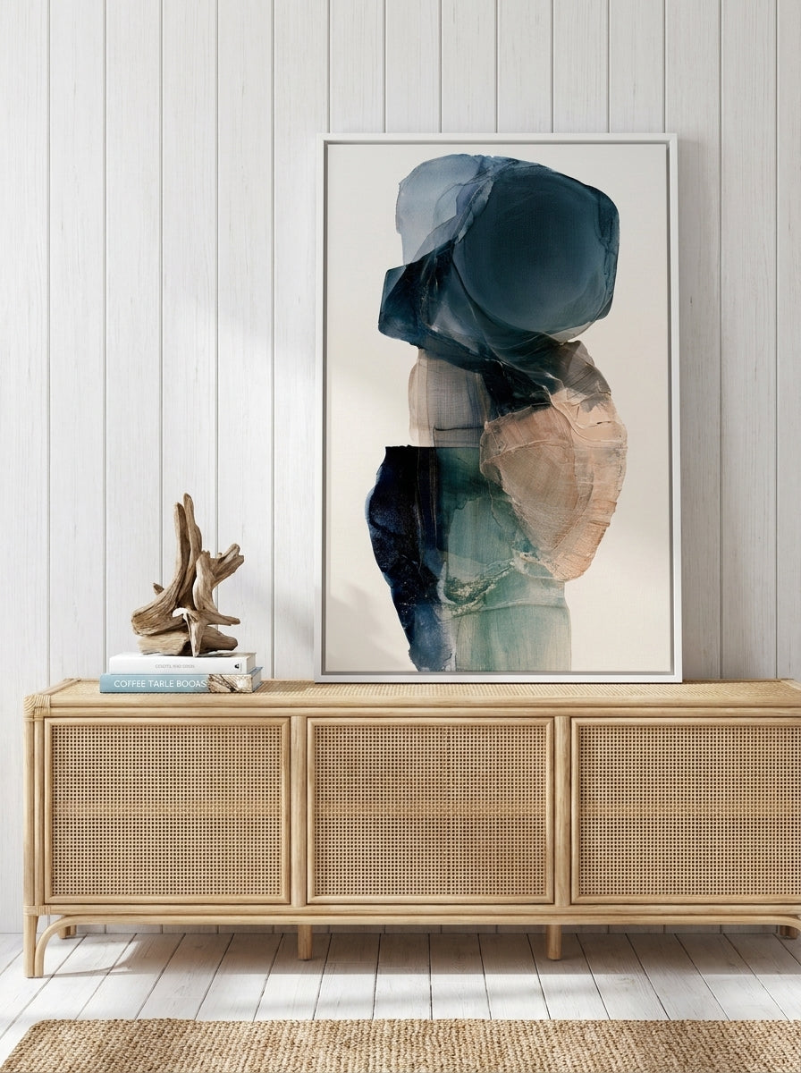 Canvas wall art with a white surround standing on a sideboard in a coastal bedroom
