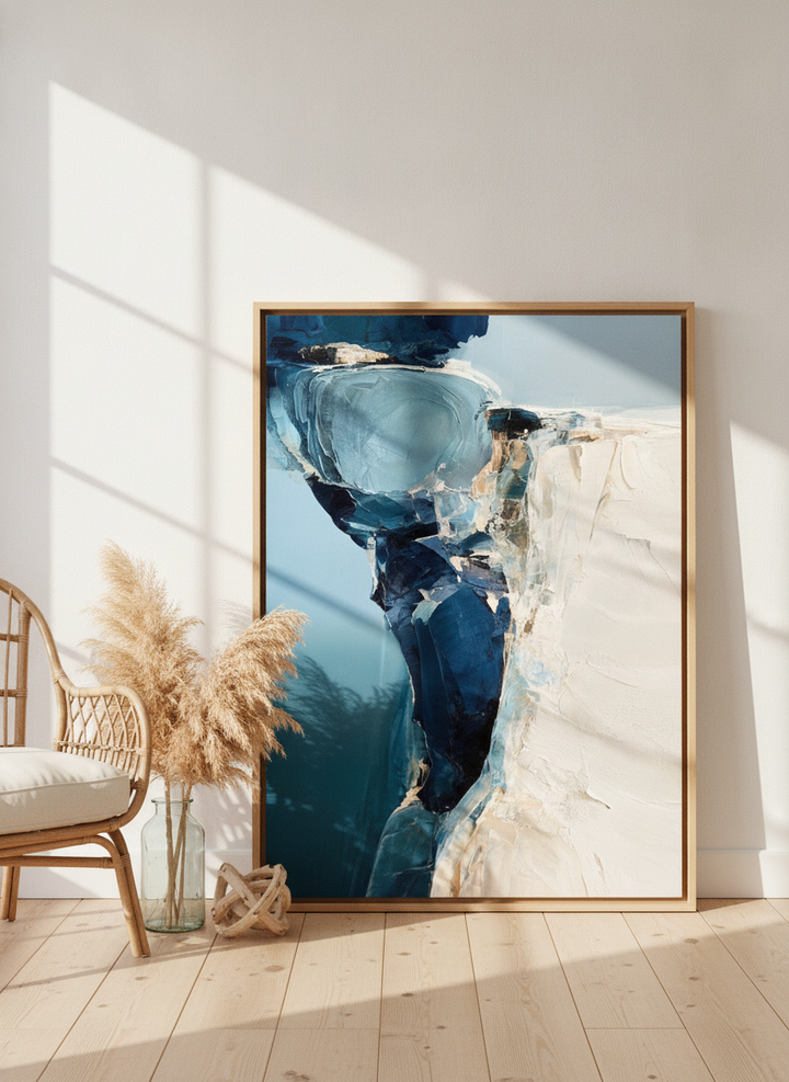 Oversized statement modern wall art print leaning against the wall in a coastal dining room