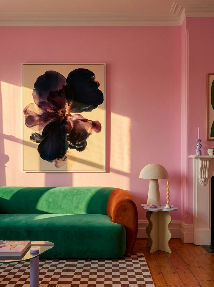 Oversized statement modern wall art print styled on the wall in a colourful eclectic living room