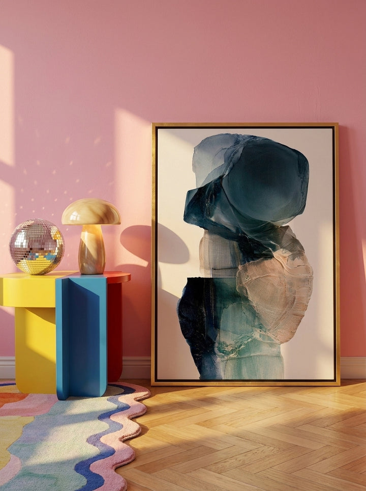 Canvas wall art with a gold leaf surround leaning against the wall in a colourful eclectic home office