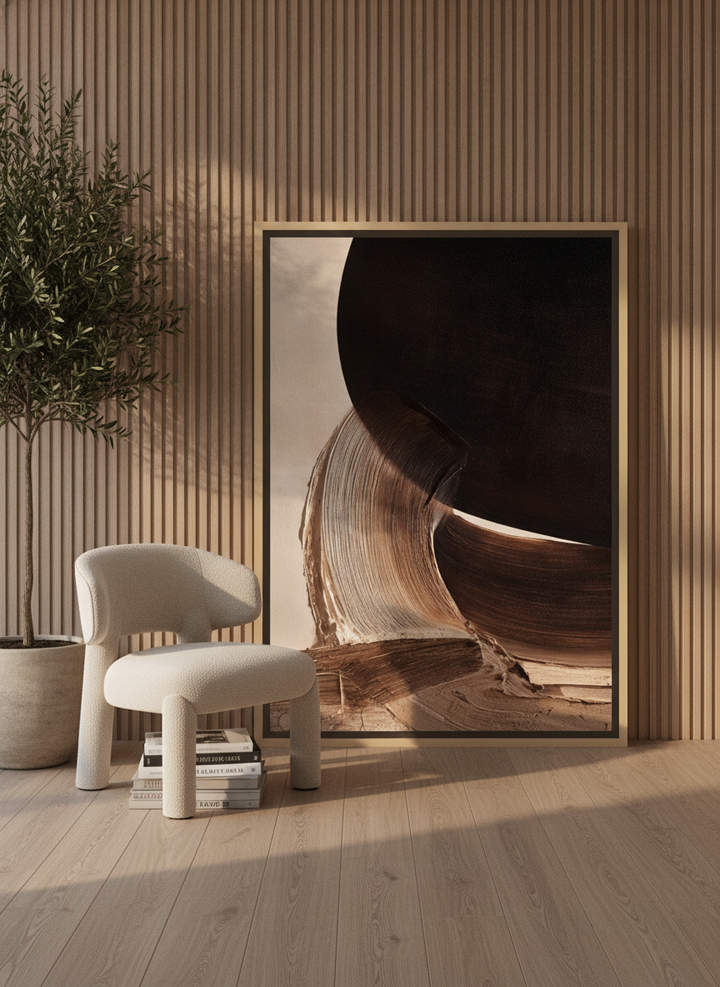 Oversized statement canvas wall art with a natural timber surround leaning against the wall in a luxe dining room