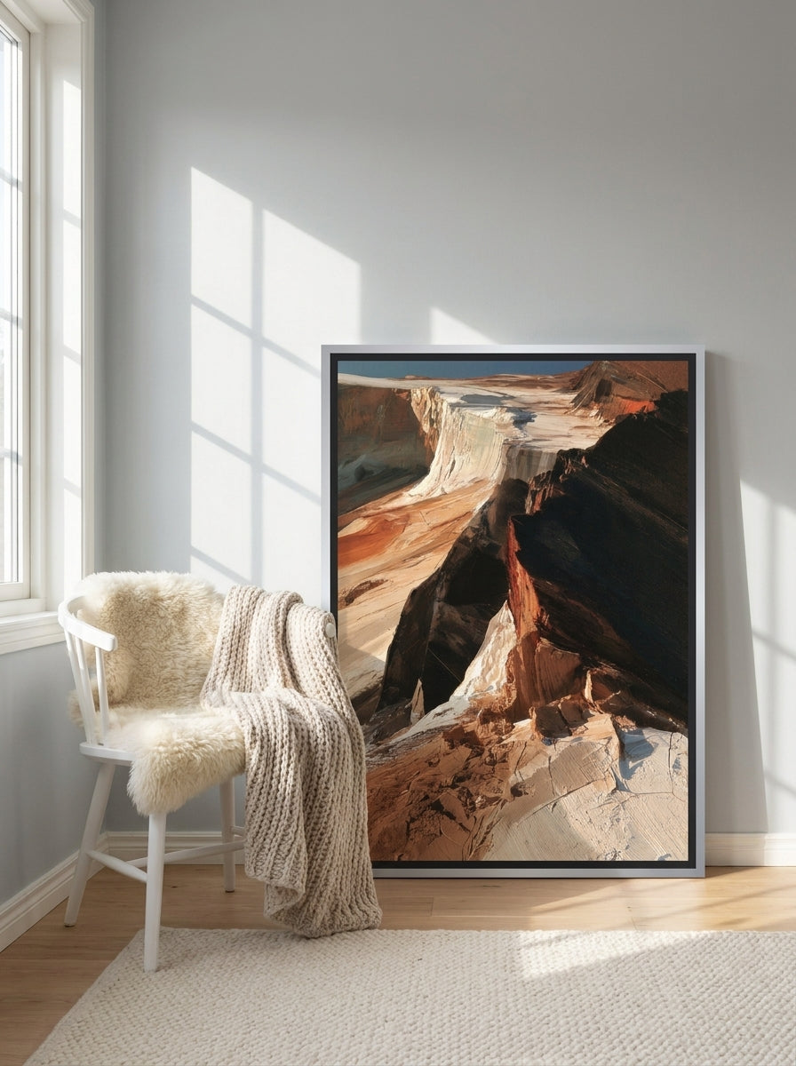Canvas wall art with a silver leaf surround leaning against the wall in a bright Scandinavian bedroom