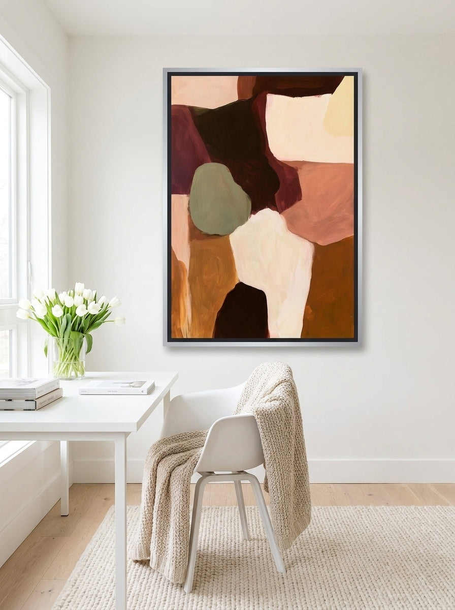 Canvas wall art with a silver leaf surround styled on the wall in a bright Scandinavian home office