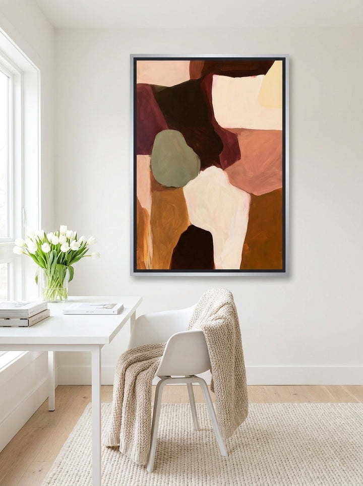 Canvas wall art with a silver leaf surround styled on the wall in a bright Scandinavian home office