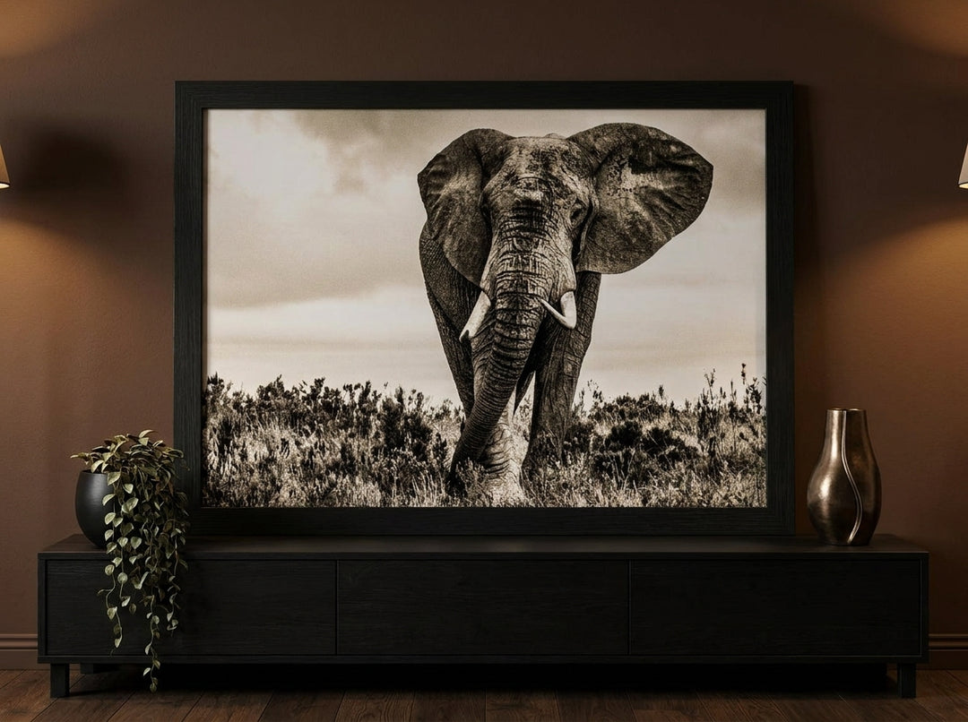 Modern wall art print standing on a console in a moody home office