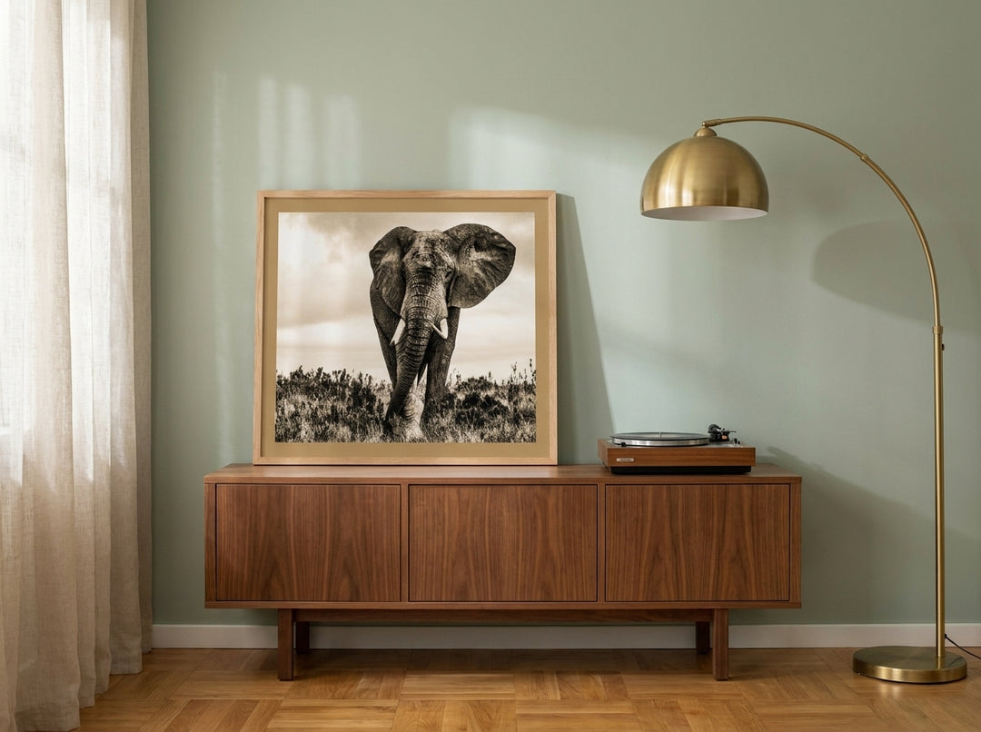 Modern wall art print standing on a sideboard in a mid-century bedroom